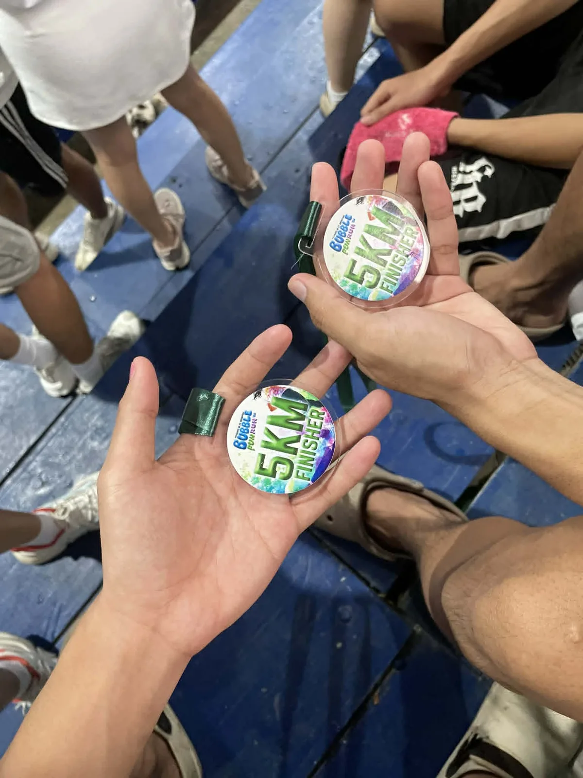 Finisher medals held after a running event